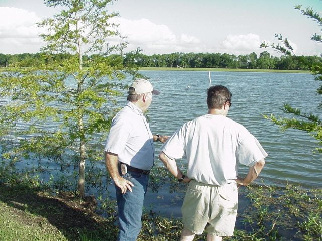 Owner Kenny Zwahr consulting with a client about vegetation