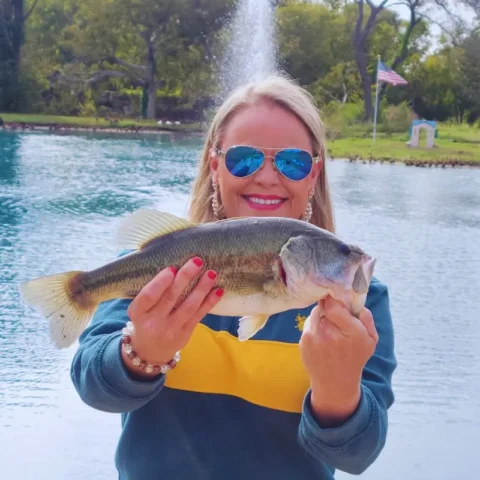 Lady holding a largemouth bass